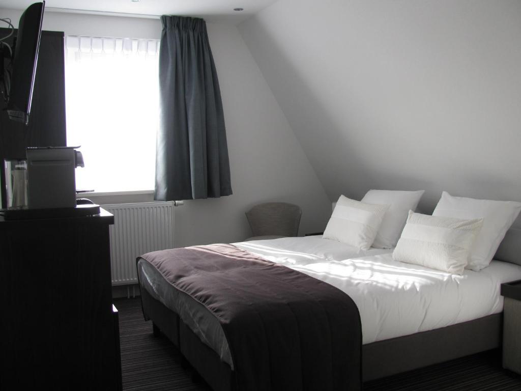 Boutique Hotel De Zwaluw De Koog  Ruang foto